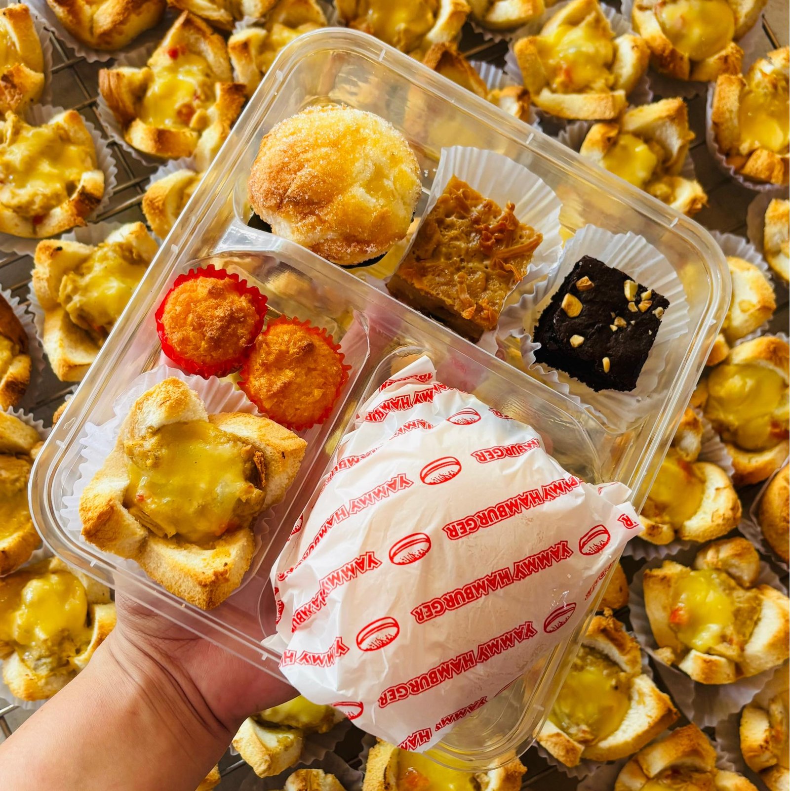 Beef Burger, Chicken ala king, Royal bibingka, Brownies, Special pudding and 2 Coconut macaroons in a Bento box