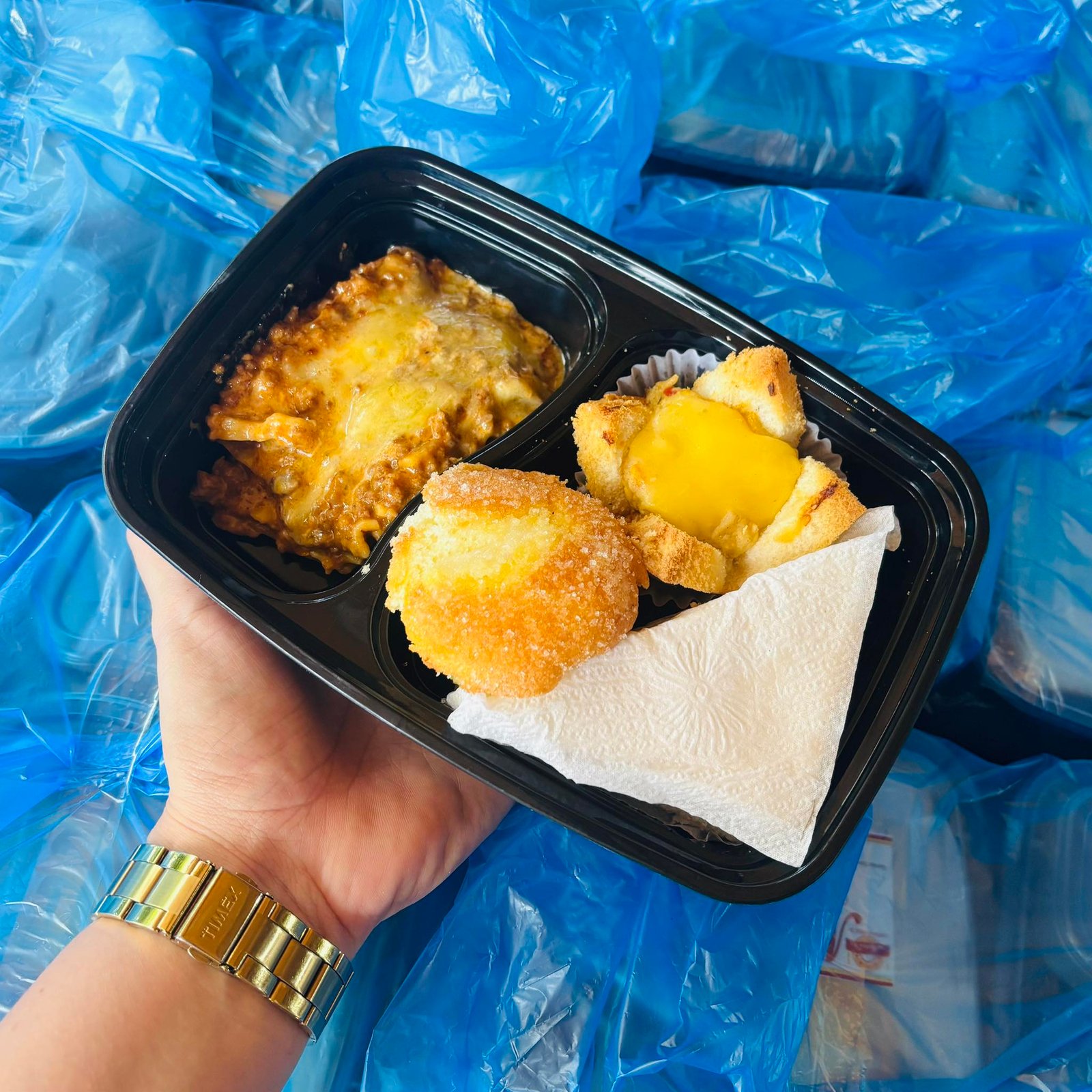 Beef Lasagna, Club Sandwich, Chicken ala King and Royal Bibingka in a Bento Box